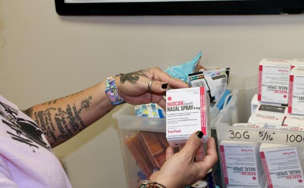 Kelly Hans holds a box of Narcan nasal spray at the county's One-Stop Shop in Austin. Kelly Hans holds a box of Narcan nasal spray at the county's One-Stop Shop in Austin.