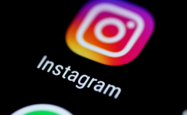 The Instagram app is seen on a phone screen. The Instagram app is seen on a phone screen.