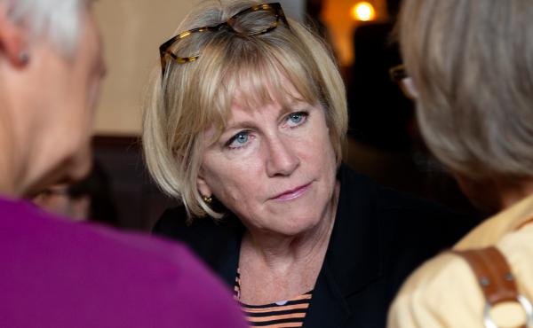 Democratic gubernatorial candidate Cathy Glasson campaigns one week before the primary election in a Des Moines restaurant. She says she thinks in order to win against Republican Gov. Kim Reynolds, she and her fellow candidates need to run far to the left Democratic gubernatorial candidate Cathy Glasson campaigns one week before the primary election in a Des Moines restaurant. She says she thinks in order to win against Republican Gov. Kim Reynolds, she and her fellow candidates need to run far to the left