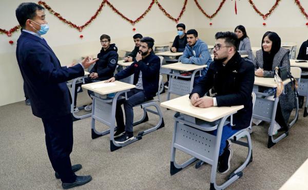 Chinese lecturer Zhiwei Hu speaks to students in the Chinese language department at Salahaddin University in Irbil, Iraq, Wednesday, Jan. 19, 2021. Chinese lecturer Zhiwei Hu speaks to students in the Chinese language department at Salahaddin University in Irbil, Iraq, Wednesday, Jan. 19, 2021.