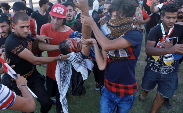 An injured protester is rushed to the hospital after being shot during a demonstration in early October in Baghdad, Iraq. An injured protester is rushed to the hospital after being shot during a demonstration in early October in Baghdad, Iraq.