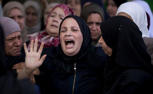 Relatives of Aisha Rabi, 48, mourn at the family home during her funeral in the West Bank village of Bidya in October 2018. Relatives of Aisha Rabi, 48, mourn at the family home during her funeral in the West Bank village of Bidya in October 2018.