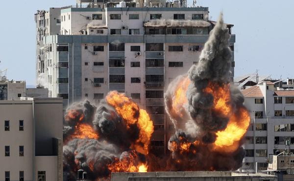 A ball of fire erupts from a building housing various international media, including The Associated Press, after an Israeli airstrike on Saturday in Gaza City. AP staffers and other tenants safely evacuated the building after the Israeli military telephon A ball of fire erupts from a building housing various international media, including The Associated Press, after an Israeli airstrike on Saturday in Gaza City. AP staffers and other tenants safely evacuated the building after the Israeli military telephon