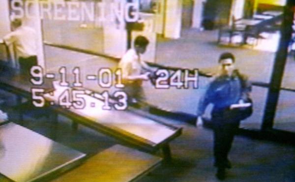 Two men identified by authorities as hijackers Mohamed Atta (right) and Abdulaziz Alomari (center) pass through airport security on Sept. 11, 2001, at Portland International Jetport in Maine in an image from airport surveillance tape released on Sept. 19, Two men identified by authorities as hijackers Mohamed Atta (right) and Abdulaziz Alomari (center) pass through airport security on Sept. 11, 2001, at Portland International Jetport in Maine in an image from airport surveillance tape released on Sept. 19,