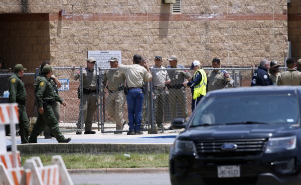 Law enforcement and first responders gather outside Robb Elementary School following Tuesday's shooting in Uvalde, Texas. Their response has since come under wide scrutiny. Law enforcement and first responders gather outside Robb Elementary School following Tuesday's shooting in Uvalde, Texas. Their response has since come under wide scrutiny.