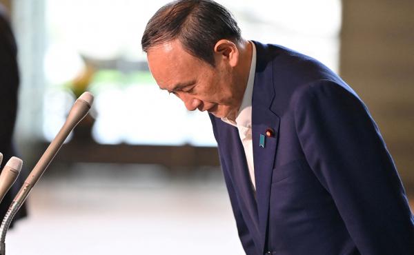 Japan's Prime Minister Yoshihide Suga bows during a press conference at the prime minister's office in Tokyo on Friday, following his announcement that he will not seek reelection for Liberal Democratic Party leadership this month. Japan's Prime Minister Yoshihide Suga bows during a press conference at the prime minister's office in Tokyo on Friday, following his announcement that he will not seek reelection for Liberal Democratic Party leadership this month.