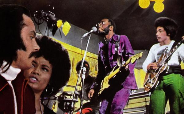 Curtis Mayfield (in purple) performs in a detail from a poster advertising the 1972 film Super Fly, for which Mayfield composed the soundtrack album. Curtis Mayfield (in purple) performs in a detail from a poster advertising the 1972 film Super Fly, for which Mayfield composed the soundtrack album.