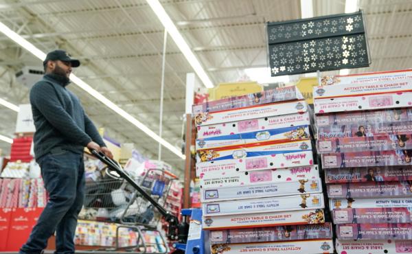 An employee stocks the toy section of a Walmart on Black Friday in King of Prussia, Pa. An employee stocks the toy section of a Walmart on Black Friday in King of Prussia, Pa.
