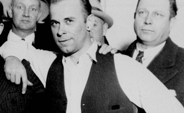 John Dillinger (center) strikes a jaunty pose after his capture in Crown Point, Ind., in February 1934. His niece and nephew hope to exhume the gangster's body to conduct forensic tests. John Dillinger (center) strikes a jaunty pose after his capture in Crown Point, Ind., in February 1934. His niece and nephew hope to exhume the gangster's body to conduct forensic tests.
