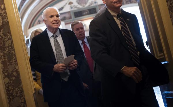 Senator John McCain leaves after a procedural vote on healthcare on Thursday, as the Senate was to vote on moving head on health care with the goal of erasing much of Barack Obama's law. Senator John McCain leaves after a procedural vote on healthcare on Thursday, as the Senate was to vote on moving head on health care with the goal of erasing much of Barack Obama's law.