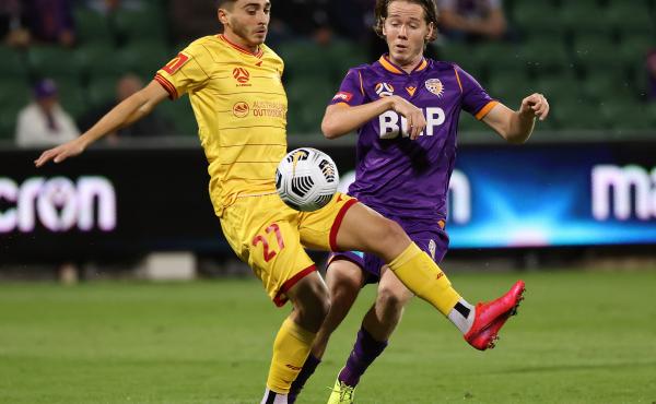 Josh Cavallo of Adelaide, left, and Daniel Stynes of the Glory contest for the ball during the A-League match between Perth Glory and Adelaide United at HBF Park, on May 19 in Perth, Australia. Josh Cavallo of Adelaide, left, and Daniel Stynes of the Glory contest for the ball during the A-League match between Perth Glory and Adelaide United at HBF Park, on May 19 in Perth, Australia.