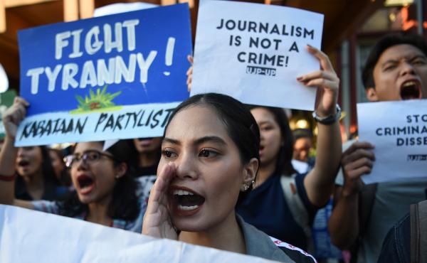 Students hold placards as they shout slogans during a protest at the state university in Manila, Philippines, on Thursday in support of Rappler CEO Maria Ressa, who was arrested a day earlier. Students hold placards as they shout slogans during a protest at the state university in Manila, Philippines, on Thursday in support of Rappler CEO Maria Ressa, who was arrested a day earlier.