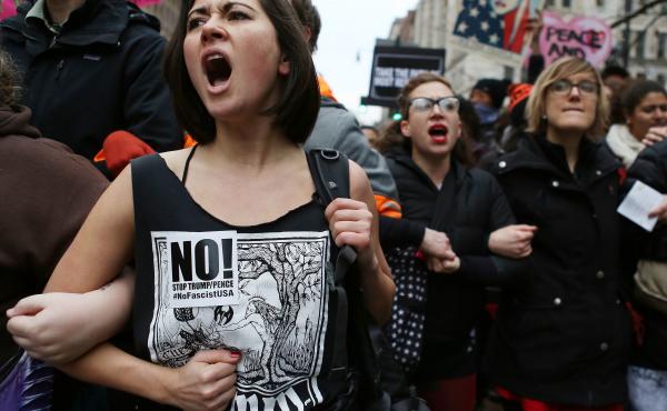 Anti-Trump protesters chant during an Inauguration Day demonstration in Washington, D.C., in January. A judge has narrowed the Justice Department's warrant for records related to a website used to plan protests. Anti-Trump protesters chant during an Inauguration Day demonstration in Washington, D.C., in January. A judge has narrowed the Justice Department's warrant for records related to a website used to plan protests.