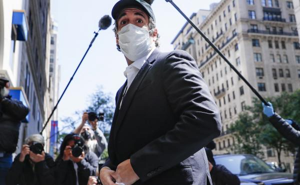 A federal judge found that Michael Cohen's return to prison earlier this month was a violation of his First Amendment rights. Cohen, shown here on release in May, had previously been granted home confinement due to coronavirus concerns. A federal judge found that Michael Cohen's return to prison earlier this month was a violation of his First Amendment rights. Cohen, shown here on release in May, had previously been granted home confinement due to coronavirus concerns.