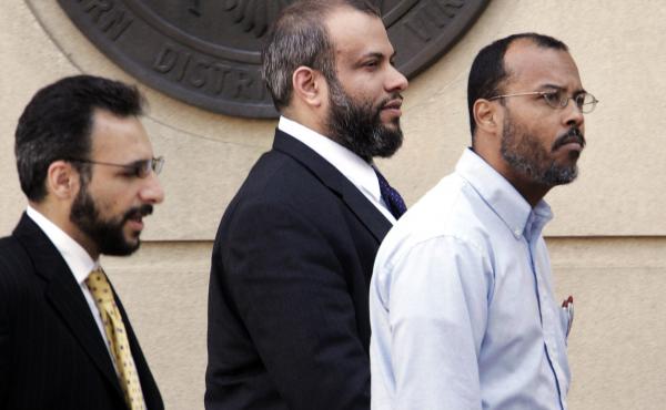 Ali Al-Tamimi (center) walks with two unidentified men as they leave federal court in Alexandria, Va., in April 2005. A federal judge has ordered him released from prison pending the outcome of his appeals, which have been unresolved for more than a decad Ali Al-Tamimi (center) walks with two unidentified men as they leave federal court in Alexandria, Va., in April 2005. A federal judge has ordered him released from prison pending the outcome of his appeals, which have been unresolved for more than a decad