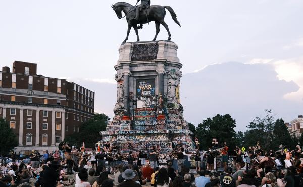 The Robert E. Lee statue on Richmond's Monument Avenue is seen here during a violin vigil to remember Elijah McClain in July. The Robert E. Lee statue on Richmond's Monument Avenue is seen here during a violin vigil to remember Elijah McClain in July.