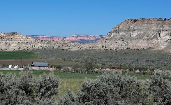 A farm sits at the foot of sandstone formations in the Grand Staircase-Escalante National Monument on May 11, 2017 outside Escalante, Utah. A farm sits at the foot of sandstone formations in the Grand Staircase-Escalante National Monument on May 11, 2017 outside Escalante, Utah.