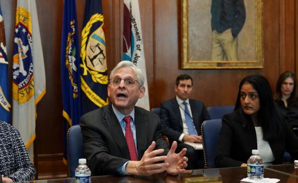 Flanked by US Deputy Attorney General Lisa Monaco (L) and Associate Attorney General Vanita Gupta, Attorney General Merrick Garland convenes a Justice Department component heads meeting at the Justice Department on March 10. Garland was prompted by an NPR Flanked by US Deputy Attorney General Lisa Monaco (L) and Associate Attorney General Vanita Gupta, Attorney General Merrick Garland convenes a Justice Department component heads meeting at the Justice Department on March 10. Garland was prompted by an NPR