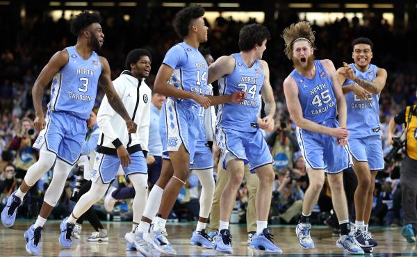 The North Carolina Tar Heels react after defeating the Duke Blue Devils 81-77 on Saturday, advancing to the final game of the 2022 NCAA Men's Basketball Tournament. The North Carolina Tar Heels react after defeating the Duke Blue Devils 81-77 on Saturday, advancing to the final game of the 2022 NCAA Men's Basketball Tournament.