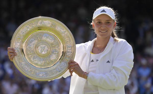 Kazakhstan's Elena Rybakina holds the trophy as she celebrates after beating Tunisia's Ons Jabeur to win the Wimbledon women's single final Saturday. Kazakhstan's Elena Rybakina holds the trophy as she celebrates after beating Tunisia's Ons Jabeur to win the Wimbledon women's single final Saturday.