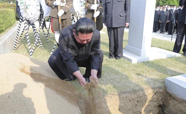 In this photo provided by the North Korean government, North Korean leader Kim Jong Un covers the coffin of Hyon Chol Hae, marshal of the Korean People's Army, with earth at a cemetery in Pyongyang, North Korea Sunday, May 22, 2022. The content of this im In this photo provided by the North Korean government, North Korean leader Kim Jong Un covers the coffin of Hyon Chol Hae, marshal of the Korean People's Army, with earth at a cemetery in Pyongyang, North Korea Sunday, May 22, 2022. The content of this im