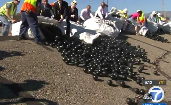 In this photo, obtained from ABC7 News in Los Angeles, the shade balls are released into the reservoir. In this photo, obtained from ABC7 News in Los Angeles, the shade balls are released into the reservoir.