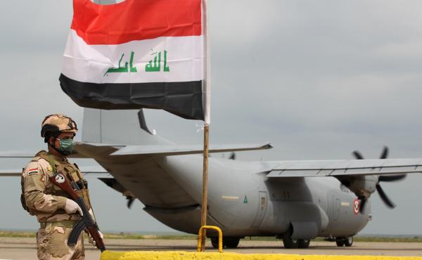 An Iraqi soldier stands guard near a U.S. military air carrier at the Qayyarah Airfield West, before the U.S. transferred the base to Iraqi forces in March. An Iraqi soldier stands guard near a U.S. military air carrier at the Qayyarah Airfield West, before the U.S. transferred the base to Iraqi forces in March.