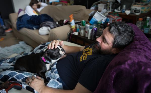 Michael Marquette pets his dog, Spring, while resting at his home in Clarksburg, Md., after a recent hip surgery to repair an injury sustained in 2009 during military duty. Michael Marquette pets his dog, Spring, while resting at his home in Clarksburg, Md., after a recent hip surgery to repair an injury sustained in 2009 during military duty.