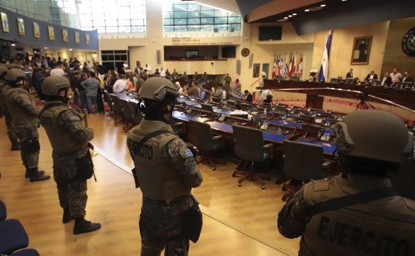 Armed Special Forces soldiers of the Salvadoran Army, following orders of President Nayib Bukele, enter El Salvador's congress during a vote on a security bill on Feb. 9. Armed Special Forces soldiers of the Salvadoran Army, following orders of President Nayib Bukele, enter El Salvador's congress during a vote on a security bill on Feb. 9.
