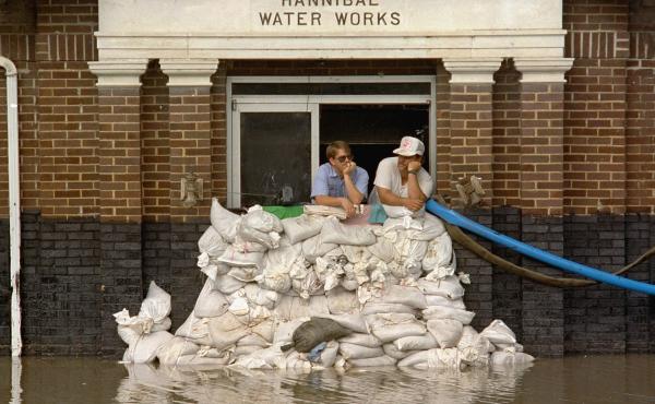 Mike Stone, left, and Andy Sherman in the pumping station for Hannibal, Mo., during a flood in 1993. The city has since constructed a flood wall, and flood managers have built up levees to protect against flooding. But scientists warn those structures are Mike Stone, left, and Andy Sherman in the pumping station for Hannibal, Mo., during a flood in 1993. The city has since constructed a flood wall, and flood managers have built up levees to protect against flooding. But scientists warn those structures are