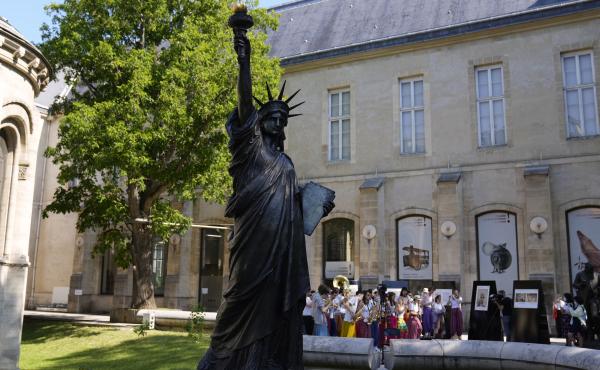 A mini replica of the French-designed Statue of Liberty will reach the U.S. on July 1. Here, the statue awaits its move in Paris on Monday. A mini replica of the French-designed Statue of Liberty will reach the U.S. on July 1. Here, the statue awaits its move in Paris on Monday.
