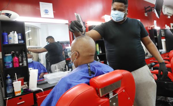 Wilkin Soto works on a customer at the Castillo Barbershop, in Lawrence, Mass., on June 5. The pace of hiring has slowed from June, when employers added a record 4.8 million jobs. Wilkin Soto works on a customer at the Castillo Barbershop, in Lawrence, Mass., on June 5. The pace of hiring has slowed from June, when employers added a record 4.8 million jobs.