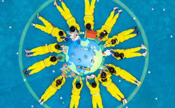 Children make an image of the Earth with green materials at a kindergarten on the 52nd Earth Day on April 22 in Changxing County, Zhejiang Province of China. Children make an image of the Earth with green materials at a kindergarten on the 52nd Earth Day on April 22 in Changxing County, Zhejiang Province of China.