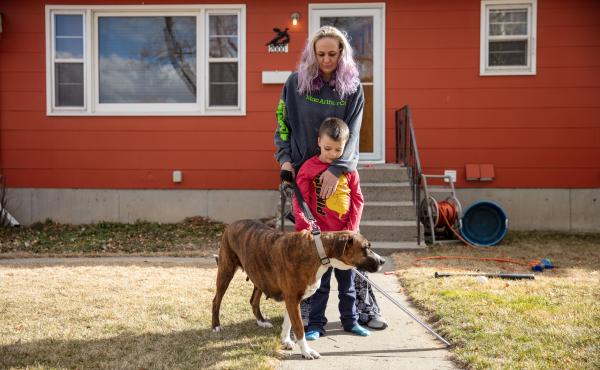 Barbara Gaught stands outside the home she's now renting in Billings, Mont., with her 5-year-old son, Blazen, and their dog, Arie. Gaught and her family were evicted from the mobile home they had owned outright and lived in for 16 years because they fell Barbara Gaught stands outside the home she's now renting in Billings, Mont., with her 5-year-old son, Blazen, and their dog, Arie. Gaught and her family were evicted from the mobile home they had owned outright and lived in for 16 years because they fell