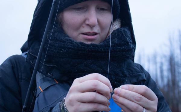 Kristy Taylor baits her hook while fishing on the Two Hearted River in Michigan. She's part of a steelhead fishing class put on by the Michigan Department of Natural Resources in an effort to inspire more women to fish. Kristy Taylor baits her hook while fishing on the Two Hearted River in Michigan. She's part of a steelhead fishing class put on by the Michigan Department of Natural Resources in an effort to inspire more women to fish.