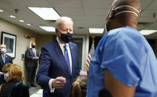 President Biden talks to recently vaccinated Army Staff Sgt. Marvin Cornish as he visits a COVID-19 vaccination site at the VA Medical Center in Washington, D.C., on Monday. President Biden talks to recently vaccinated Army Staff Sgt. Marvin Cornish as he visits a COVID-19 vaccination site at the VA Medical Center in Washington, D.C., on Monday.