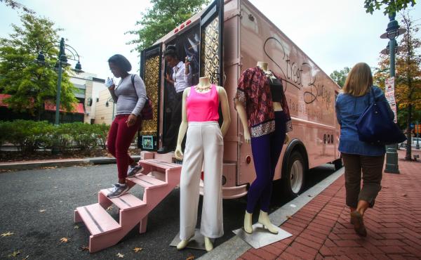 Customers walk out of Street Boutique, parked in Shirlington Village, Va. Street Boutique is a pop-up truck that's similar to the many food trucks in the area, except it sells clothes and jewelry. Customers walk out of Street Boutique, parked in Shirlington Village, Va. Street Boutique is a pop-up truck that's similar to the many food trucks in the area, except it sells clothes and jewelry.