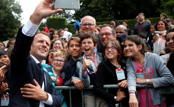 While French President, Emmanuel Macron, took selfies with some members of the crowd, he scolded one teen at the Mont Valerien National Memorial in Suresnes. While French President, Emmanuel Macron, took selfies with some members of the crowd, he scolded one teen at the Mont Valerien National Memorial in Suresnes.
