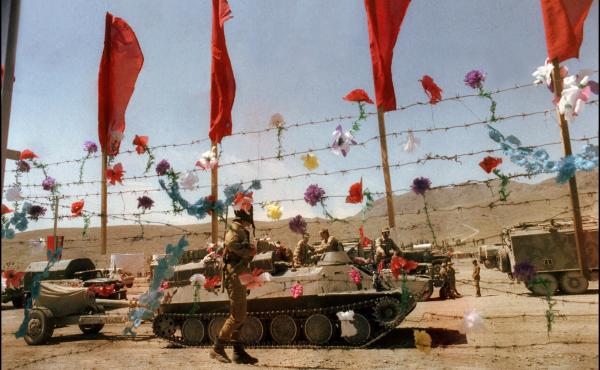 Artificial flowers decorate barbed wire fence as Soviet army troops stop in Kabul, Afghanistan, in May 1988. The Soviet Union invaded Afghanistan in December 1979 to shore up the pro-Soviet regime in Kabul. Artificial flowers decorate barbed wire fence as Soviet army troops stop in Kabul, Afghanistan, in May 1988. The Soviet Union invaded Afghanistan in December 1979 to shore up the pro-Soviet regime in Kabul.