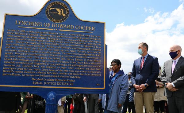 Maryland Gov. Larry Hogan, far right, Baltimore County Executive John Olszewski and Maryland House Speaker Adrienne Jones stand next to a new historic marker on Saturday in Towson, Md., that memorializes Howard Cooper, a 15-year-old who was dragged from a Maryland Gov. Larry Hogan, far right, Baltimore County Executive John Olszewski and Maryland House Speaker Adrienne Jones stand next to a new historic marker on Saturday in Towson, Md., that memorializes Howard Cooper, a 15-year-old who was dragged from a