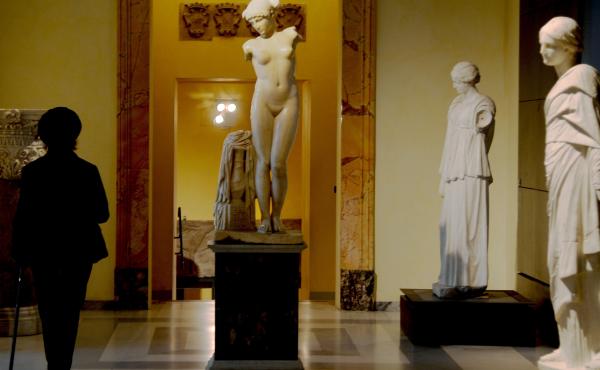 A picture taken on Tuesday shows a visitor walking past an ancient Roman marble statue at Rome's Capitoline Museum. A picture taken on Tuesday shows a visitor walking past an ancient Roman marble statue at Rome's Capitoline Museum.