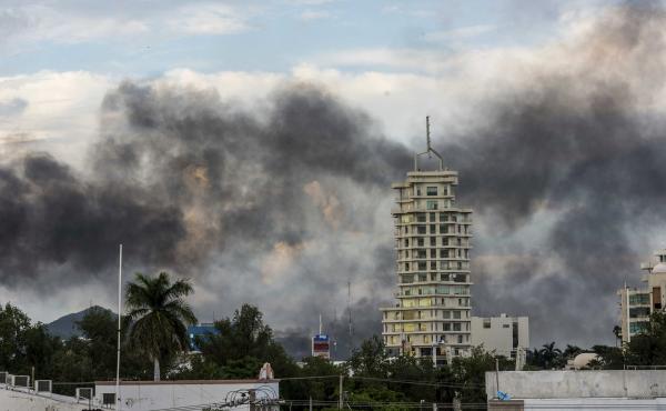 Smoke from burning cars rises in Culiacán, Mexico, on Thursday, after an intense gunfight between security forces and gunmen linked to the Sinaloa drug cartel. Smoke from burning cars rises in Culiacán, Mexico, on Thursday, after an intense gunfight between security forces and gunmen linked to the Sinaloa drug cartel.
