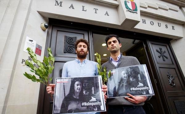 Matthew Caruana Galizia (left) and Paul Caruana Galizia, the sons of murdered Maltese journalist Daphne Caruana Galizia, attend a vigil outside the Maltese High Commission in London on April 16, six months after she was assassinated. Matthew Caruana Galizia (left) and Paul Caruana Galizia, the sons of murdered Maltese journalist Daphne Caruana Galizia, attend a vigil outside the Maltese High Commission in London on April 16, six months after she was assassinated.