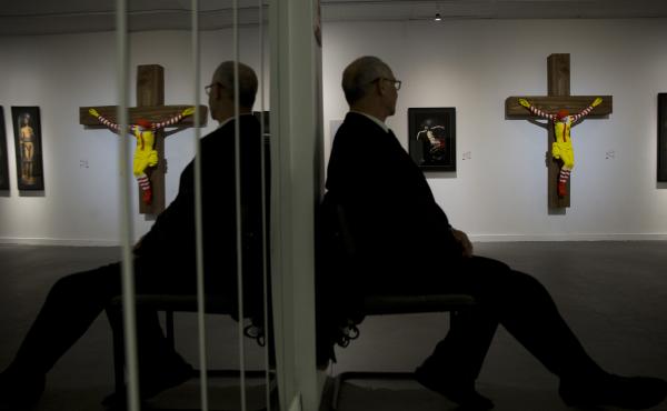 The sculpture, known as McJesus, was created by Finnish artist Jani Leinonen and displayed as part of the Haifa Museum of Art's "Sacred Goods" exhibition in Israel. The piece, seen on display in the museum Monday, prompted vehement pushback from Christian The sculpture, known as McJesus, was created by Finnish artist Jani Leinonen and displayed as part of the Haifa Museum of Art's "Sacred Goods" exhibition in Israel. The piece, seen on display in the museum Monday, prompted vehement pushback from Christian