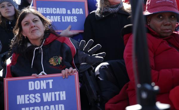 Health care activists rallied in front of the U.S. Capitol on March 22, 2017, to protest Republican efforts that would have dismantled the Affordable Care Act and capped federal payments for Medicaid patients. The Republican congressional bills, part of t Health care activists rallied in front of the U.S. Capitol on March 22, 2017, to protest Republican efforts that would have dismantled the Affordable Care Act and capped federal payments for Medicaid patients. The Republican congressional bills, part of t