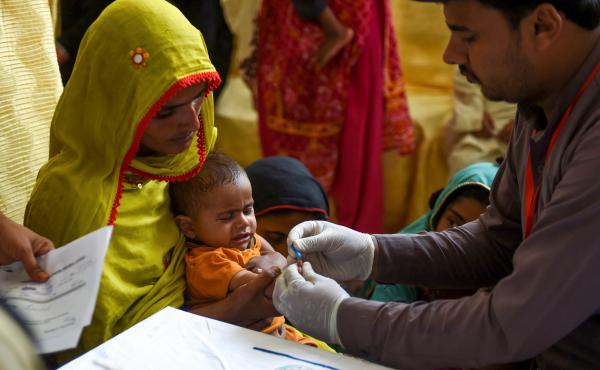 In Larkana, Pakistan, on May 9, 2019, a paramedic takes a blood sample from a baby for a HIV test. The government is offering screenings in the wake of an HIV outbreak. In Larkana, Pakistan, on May 9, 2019, a paramedic takes a blood sample from a baby for a HIV test. The government is offering screenings in the wake of an HIV outbreak.