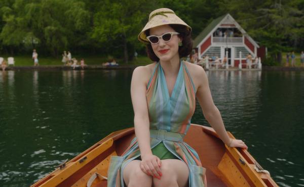In the second season of The Marvelous Mrs. Maisel, Midge (Rachel Brosnahan) visits the Catskills. Costume designer Donna Zakowska says this outfit "in the boat with a funny lampshade hat" was among her favorites. In the second season of The Marvelous Mrs. Maisel, Midge (Rachel Brosnahan) visits the Catskills. Costume designer Donna Zakowska says this outfit "in the boat with a funny lampshade hat" was among her favorites.