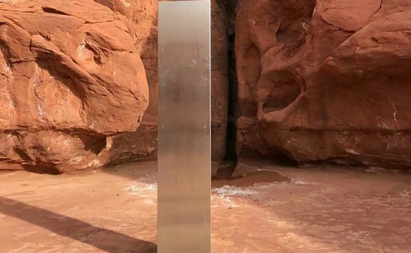 This Nov. 18 photo, provided by the Utah Department of Public Safety, shows a metal monolith in the ground in a remote area in Utah. The mysterious monolith has disappeared less than 10 days after it was spotted by wildlife biologists. This Nov. 18 photo, provided by the Utah Department of Public Safety, shows a metal monolith in the ground in a remote area in Utah. The mysterious monolith has disappeared less than 10 days after it was spotted by wildlife biologists.