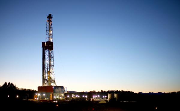 A natural gas drilling rig's lights shimmer in the evening light near Silt, Colo. Methane is the main component of natural gas, and studies show some methane escapes from leaky oil and gas operations. A natural gas drilling rig's lights shimmer in the evening light near Silt, Colo. Methane is the main component of natural gas, and studies show some methane escapes from leaky oil and gas operations.