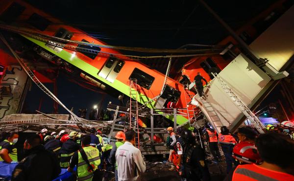 Emergency personnel search for survivors after a raised subway track collapsed Monday night in Mexico City. Emergency personnel search for survivors after a raised subway track collapsed Monday night in Mexico City.